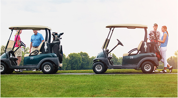 golfers hanging around two golf carts
